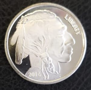 A one-ounce silver bullion round with an Indian Head design, valued on its silver content