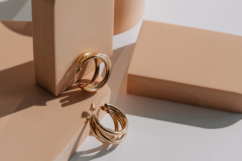 gold buyer hoop earrings display